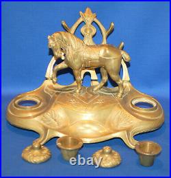 A charming circus horse double inkwell with pen rests, 19th century, brass liner