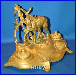 A charming circus horse double inkwell with pen rests, 19th century, brass liner