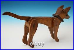 Antique American folk art treen model of an articulated Circus dog