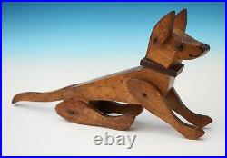 Antique American folk art treen model of an articulated Circus dog